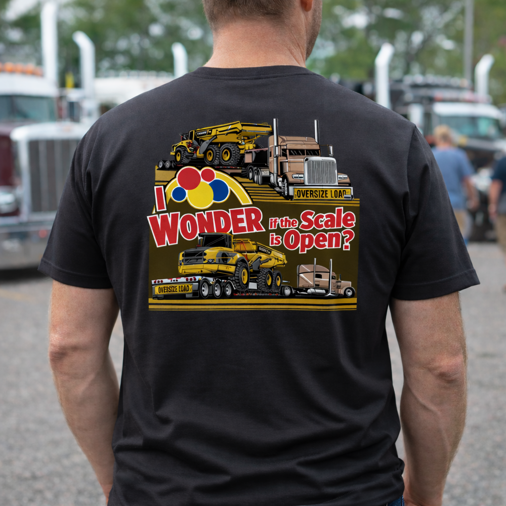 Person wearing a black t-shirt with a I Wonder if the Scale is Open T-shirt at a truck show